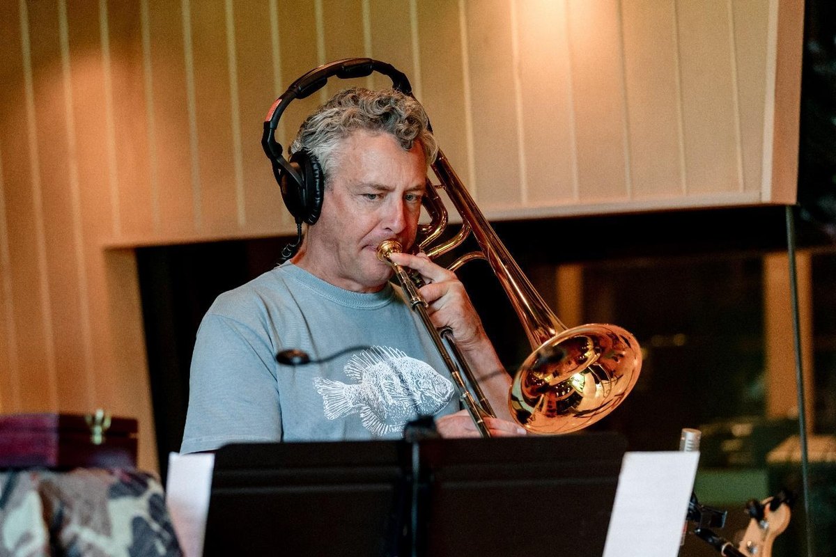Mark Lakkmann playing trombone in the studio