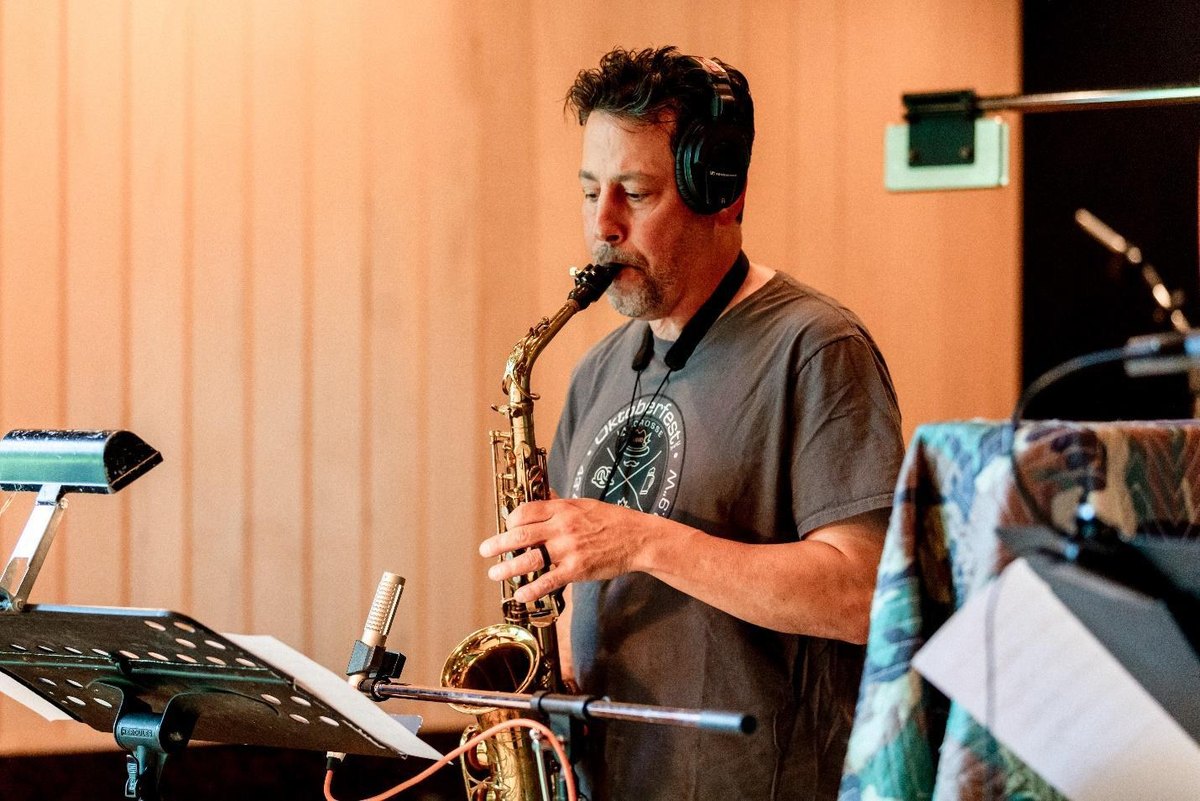 Chip Schreader playing saxophone in the studio